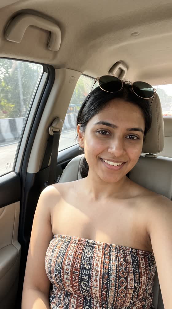 A customer in a strapless top in a car.